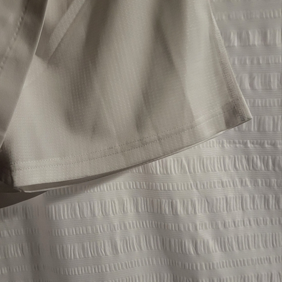 NWT Adidas golf or tennis skort. Front pockets.  White.  Orange logo. Size Small - Picture 5 of 7